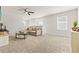 Spacious living room with plush carpeting, neutral walls, and ample natural light creating a cozy atmosphere at 2321 Copper Creek Loop, Longs, SC 29568