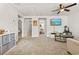 Open living room with plush carpeting, neutral walls, and connected to other rooms creating a cozy atmosphere at 2321 Copper Creek Loop, Longs, SC 29568