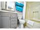 Clean bathroom offering a vanity, toilet, and a shower/tub combo with refreshing turquoise accents at 2401 S Ocean Blvd. # 854, Myrtle Beach, SC 29577