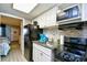 Efficient kitchen featuring modern appliances and backsplash, adjacent to sleeping and living areas at 2401 S Ocean Blvd. # 854, Myrtle Beach, SC 29577