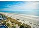 Overhead shot of beach and ocean, with buildings and vegetation in the background at 2401 S Ocean Blvd. # 859, Myrtle Beach, SC 29577