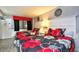 Cozy bedroom with two beds featuring a gray wall and gray-and-red flower pattern bedding at 2401 S Ocean Blvd. # 859, Myrtle Beach, SC 29577