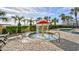 Charming splash pad area with palm trees, a playful mushroom fountain, and a nearby jacuzzi at 2401 S Ocean Blvd. # 859, Myrtle Beach, SC 29577