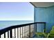 Balcony view overlooking the ocean with seating on a sunny day at 2401 S Ocean Blvd. # 953, Myrtle Beach, SC 29577