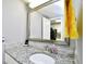 A bathroom featuring a granite countertop vanity and a decorative mirror at 2401 S Ocean Blvd. # 953, Myrtle Beach, SC 29577