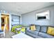 Inviting living room with sleeper sofa, shelving and lots of natural light at 2401 S Ocean Blvd. # 953, Myrtle Beach, SC 29577