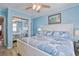 Bright bedroom with a queen-size bed, mirrored closet, and soft blue walls at 2405 S Ocean Blvd. # 304, North Myrtle Beach, SC 29582