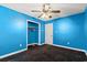 Bedroom featuring a closet, neutral-colored walls, and black carpet at 2560 Wise Rd., Conway, SC 29526