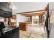 Well-lit kitchen open to living space features an island and exposed beam ceiling at 2560 Wise Rd., Conway, SC 29526