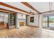 Bright living room with hardwood floors, white brick fireplace and sliding door access to outdoor living at 2560 Wise Rd., Conway, SC 29526