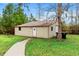 Outbuilding with metal siding and roof with green space, providing additional storage or workspace at 2560 Wise Rd., Conway, SC 29526