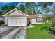 Charming single-story home with well-manicured lawn and attached two car garage at 305 Aqua Vista Ct., Myrtle Beach, SC 29588