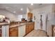 Efficient kitchen with white appliances, wooden cabinets, and an open layout at 305 Aqua Vista Ct., Myrtle Beach, SC 29588