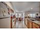 View of the kitchen leading into the dining area, featuring tile floors and standard appliances at 305 Aqua Vista Ct., Myrtle Beach, SC 29588