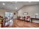 Well-lit living room with hardwood floors, a ceiling fan, and plenty of natural light at 305 Aqua Vista Ct., Myrtle Beach, SC 29588