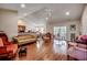 Open living room showcasing hardwood floors, high ceilings, and slider doors at 305 Aqua Vista Ct., Myrtle Beach, SC 29588