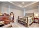 Comfortable bedroom with tray ceilings, neutral walls, carpet, and furniture at 305 Aqua Vista Ct., Myrtle Beach, SC 29588