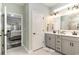 Bathroom with dual sinks and a view into the main bedroom at 3074 Viceroy Loop, Little River, SC 29566