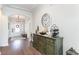 Inviting foyer features an arched entrance, hardwood floors, and elegant decorative accents at 3074 Viceroy Loop, Little River, SC 29566