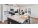 Kitchen with stainless steel appliances, granite counters, wine rack and breakfast bar at 3074 Viceroy Loop, Little River, SC 29566