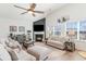 Bright living room with fireplace, high ceilings, neutral decor and a cozy seating arrangement at 3074 Viceroy Loop, Little River, SC 29566