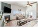 Bright living room with fireplace, high ceilings, neutral decor and a cozy seating arrangement at 3074 Viceroy Loop, Little River, SC 29566