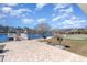 Scenic pond view featuring a lakeside picnic area with grills and a putting green, perfect for outdoor activities at 3074 Viceroy Loop, Little River, SC 29566