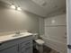 Bathroom featuring white cabinetry, quartz countertop, and a shower-tub combo at 3121 Tiger Tail Rd., Conway, SC 29526