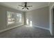 Light-filled bedroom with plush carpeting and large windows at 3121 Tiger Tail Rd., Conway, SC 29526