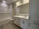 Bathroom with double sink vanity, white cabinets, and a shower-tub combo at 3135 Tiger Tail Rd., Conway, SC 29526