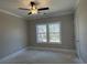 Spacious bedroom with natural light, a ceiling fan, and a large window at 3135 Tiger Tail Rd., Conway, SC 29526