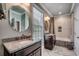 Bathroom featuring double sink vanity with granite counters and a shower-tub combo at 316 Shuffleboard Ct., Myrtle Beach, SC 29572