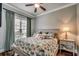 Bedroom with a ceiling fan, hardwood floors, and a large window at 316 Shuffleboard Ct., Myrtle Beach, SC 29572