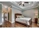 Bedroom with tray ceiling, ceiling fan, and hardwood floors at 316 Shuffleboard Ct., Myrtle Beach, SC 29572