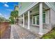 Covered patio with brick accents and columns, ideal for outdoor seating and relaxation at 316 Shuffleboard Ct., Myrtle Beach, SC 29572