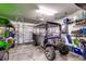 Golf cart parked in a well-equipped garage space at 316 Shuffleboard Ct., Myrtle Beach, SC 29572