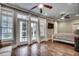 Spacious main bedroom featuring two ceiling fans, hardwood floors, and a walk out balcony at 316 Shuffleboard Ct., Myrtle Beach, SC 29572