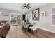 Dining area featuring a glass table with white chairs, an open floor plan, and access to a patio at 3228 Goldenrain Ln., Little River, SC 29566