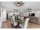 Open floorplan with dining area connecting the kitchen and living room, with wood flooring at 3228 Goldenrain Ln., Little River, SC 29566