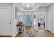 Bright foyer with wood floors, stylish decor, and a view into the open living spaces at 3228 Goldenrain Ln., Little River, SC 29566