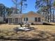 Rear exterior view of the home, showing the yard, patio, and backyard amenities at 330 Fairwood Terrace, Myrtle Beach, SC 29588