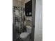 Bathroom with a gray marble-design shower curtain and a white toilet at 330 Fairwood Terrace, Myrtle Beach, SC 29588