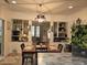 The dining room has built-in shelving, a light fixture and a view into the living room at 330 Fairwood Terrace, Myrtle Beach, SC 29588