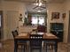 This dining room has a table with seating for four and a view into the kitchen and the fish tank at 330 Fairwood Terrace, Myrtle Beach, SC 29588