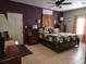 Main bedroom with a decorative bed, ceiling fan, dresser, and access to an exterior door at 330 Fairwood Terrace, Myrtle Beach, SC 29588