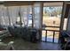 Inviting sunroom with tiled floors, rocking chair and view of the yard at 330 Fairwood Terrace, Myrtle Beach, SC 29588