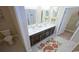 Functional bathroom featuring double sink vanity, tiled floor, and convenient access to walk-in closet at 354 Glacier Way, Conway, SC 29526