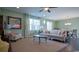 Cozy living room showcasing neutral furniture, hardwood floors, and natural light from large windows at 354 Glacier Way, Conway, SC 29526