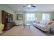 Comfortable living room featuring neutral decor, large windows, hardwood floors, and modern entertainment center at 354 Glacier Way, Conway, SC 29526