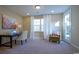 Bright study featuring functional desk space, cozy chair and generous natural light from the adjacent door at 354 Glacier Way, Conway, SC 29526